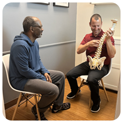 Chiropractor Orlando FL Richard Lerner With Patient And Spine