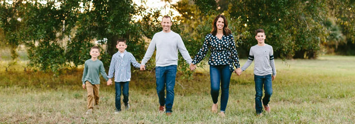 Chiropractor Orlando FL Richard Lerner And Alicia Lerner With Family Walking